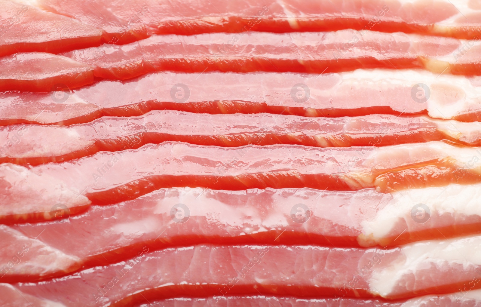 Photo of Raw bacon as background, closeup