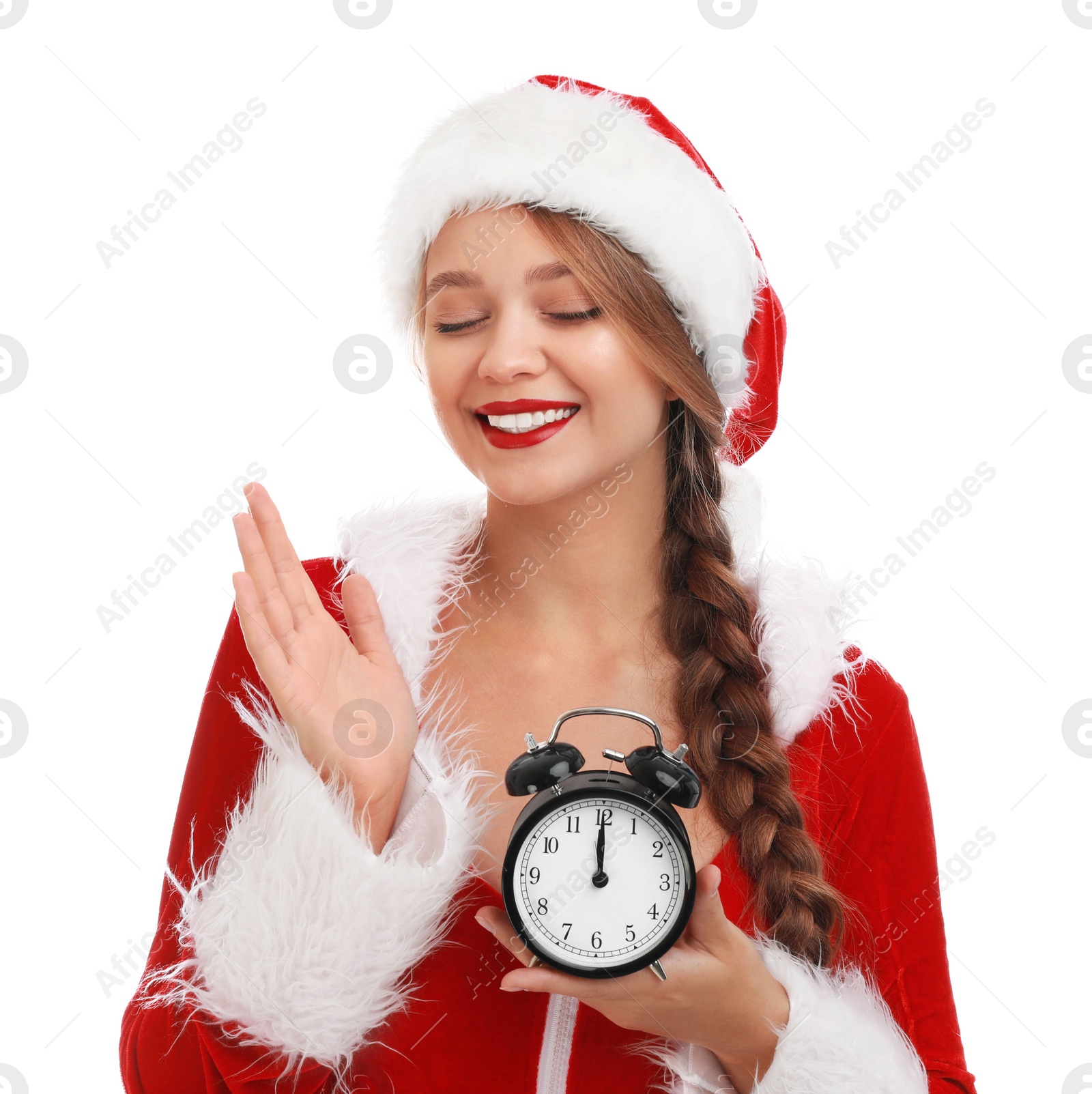 Photo of Beautiful Santa girl with alarm clock on white background. Christmas eve