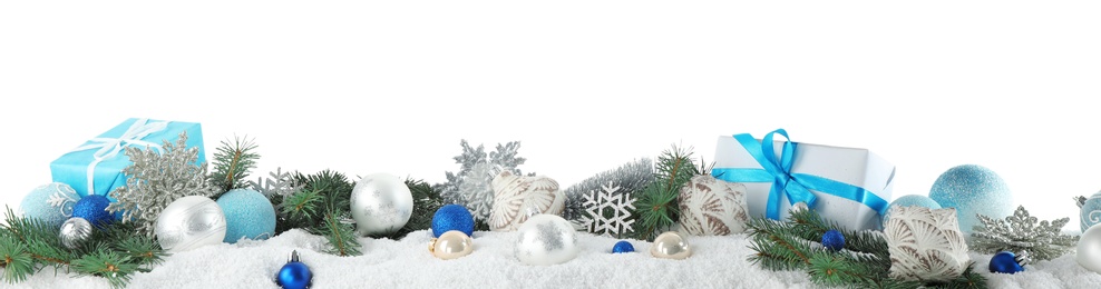 Photo of Fir branches, Christmas decoration and snow against white background