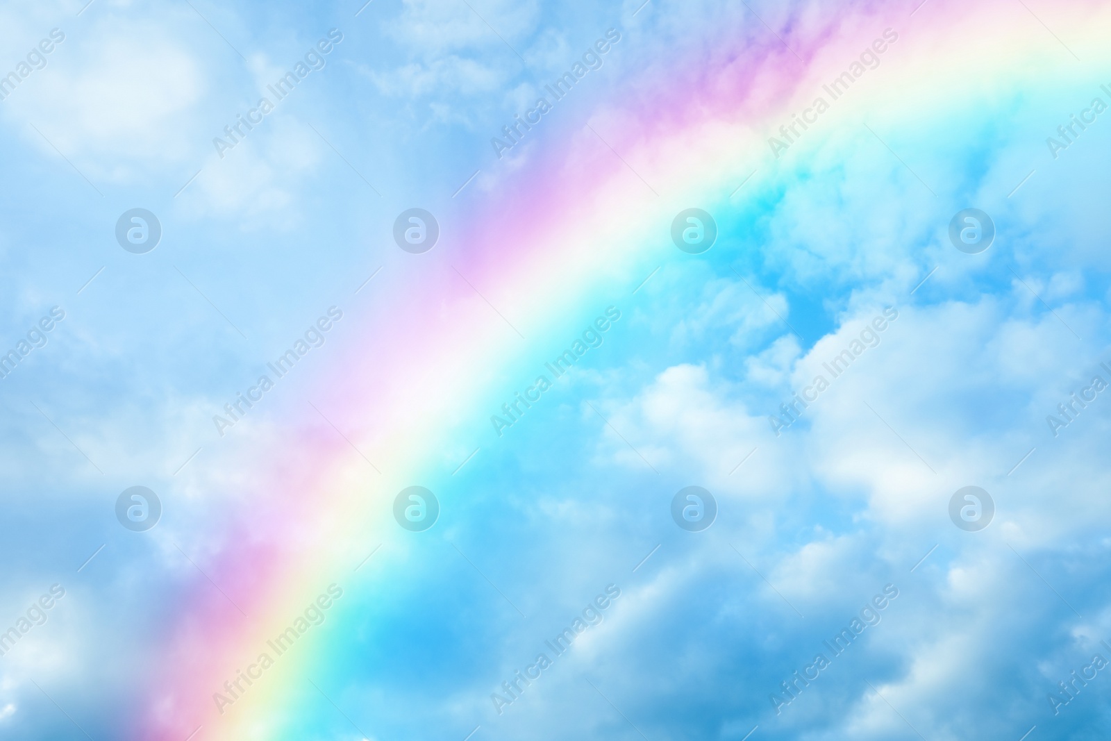 Image of Picturesque view of beautiful rainbow and blue sky on sunny day 