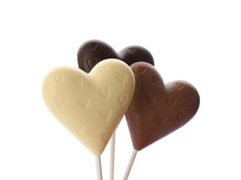 Heart shaped lollipops made of chocolate on white background