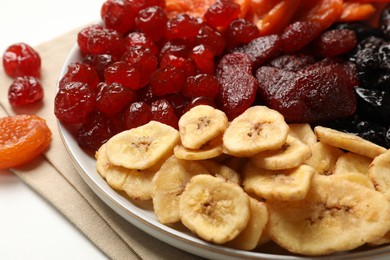 Photo of Delicious dried fruits on white table, closeup