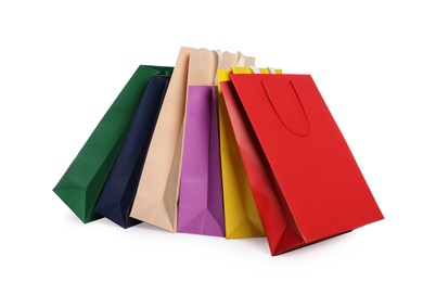 Photo of Colorful paper shopping bags isolated on white