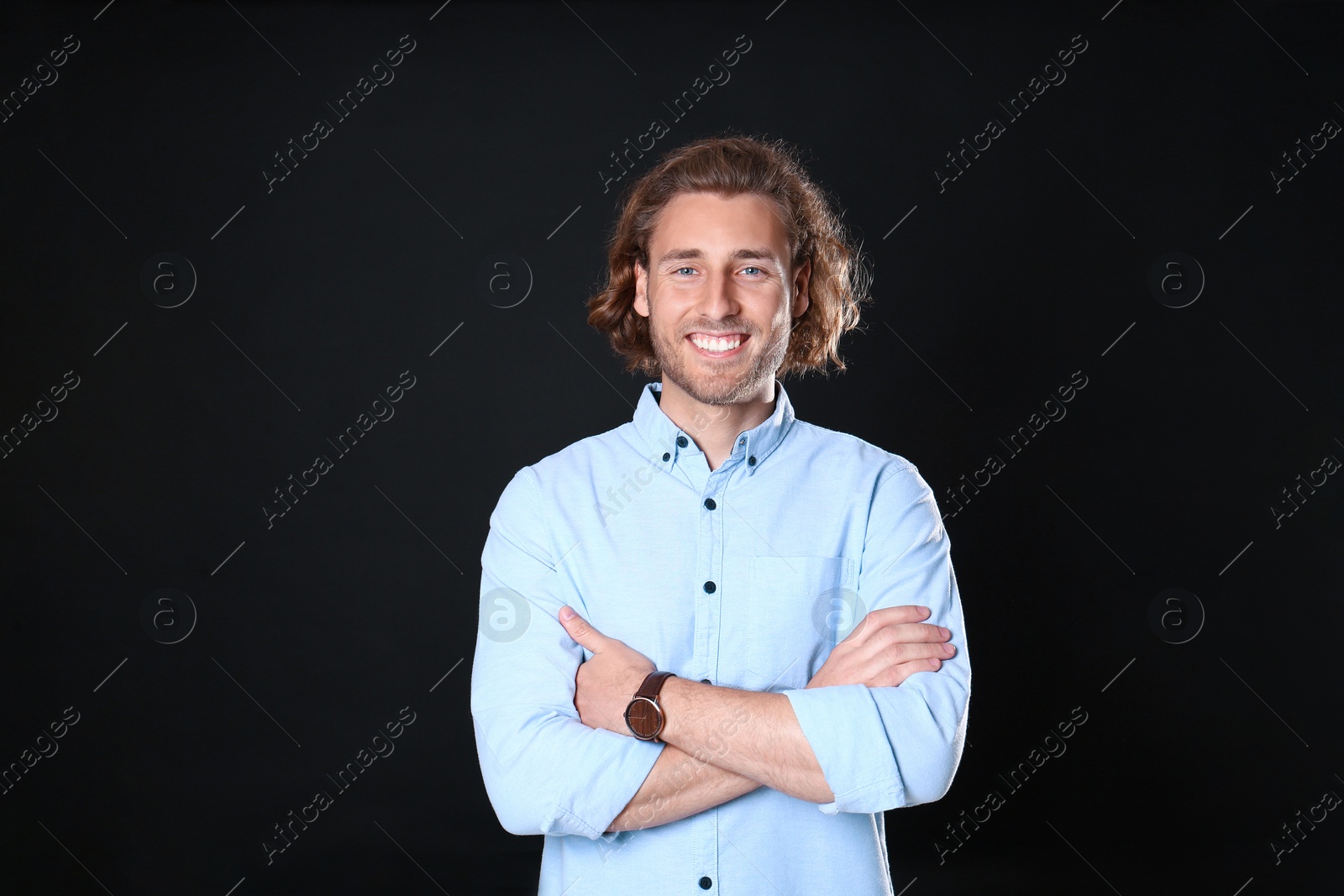 Photo of Portrait of handsome man on black background