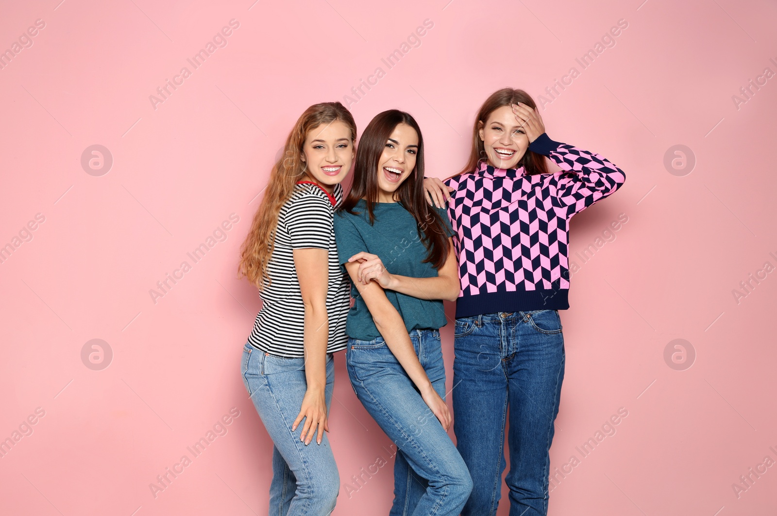 Photo of Portrait of young women laughing on color background. Space for text