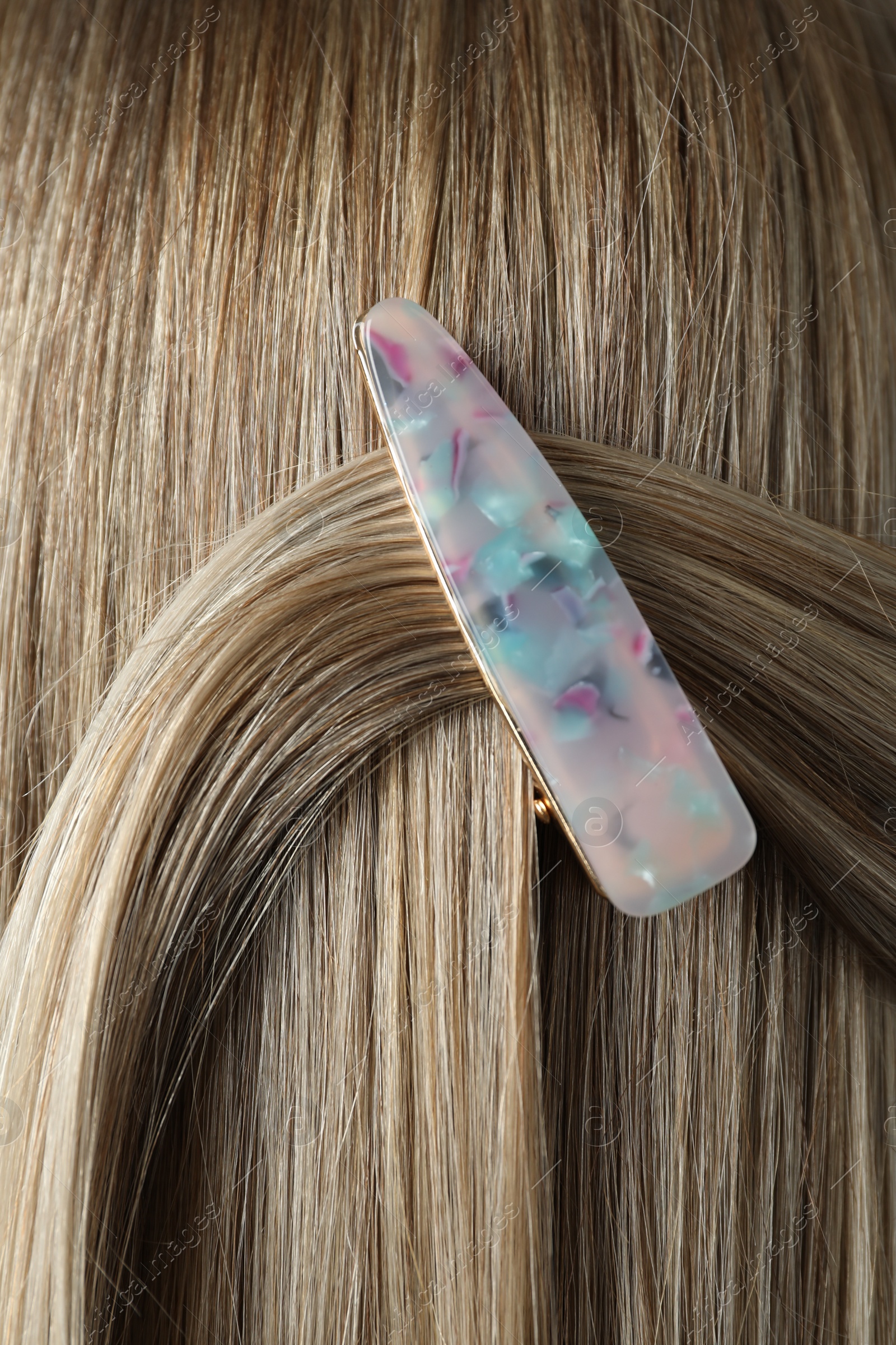 Photo of Young woman with beautiful hair clip, closeup