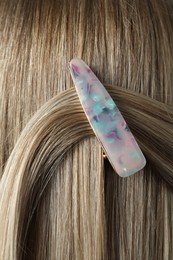 Photo of Young woman with beautiful hair clip, closeup