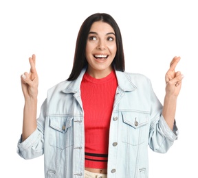 Photo of Woman with crossed fingers on white background. Superstition concept