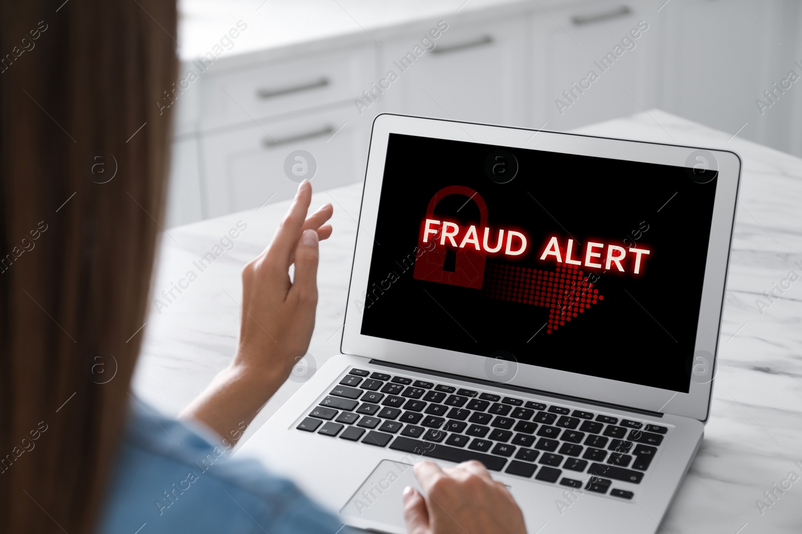 Image of Fraud prevention security system. Woman using laptop at white table, closeup