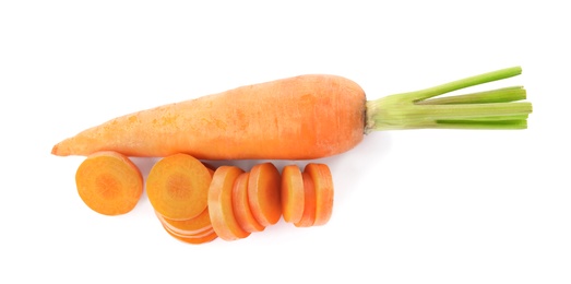 Whole and cut ripe carrots isolated on white, top view