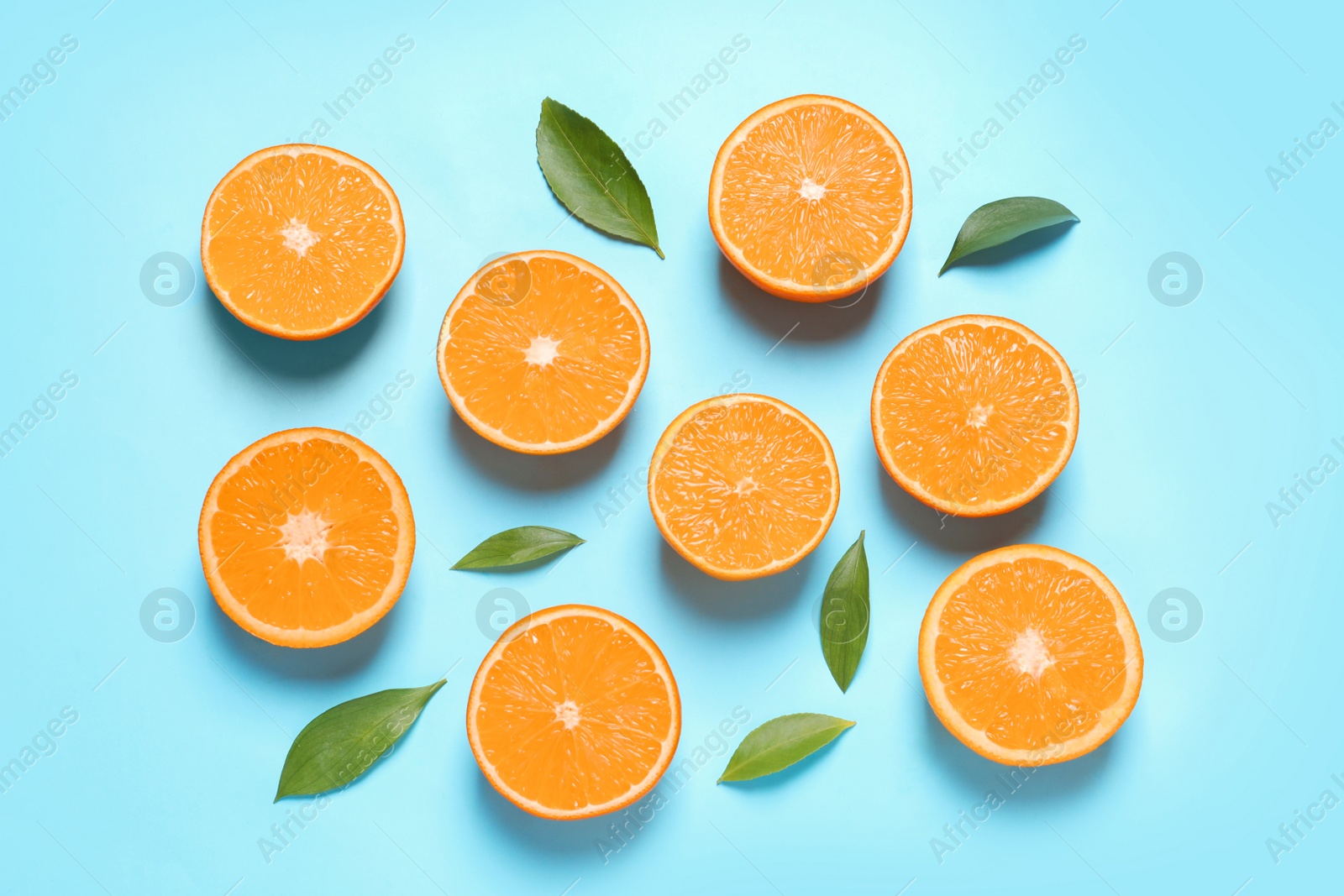 Photo of Flat lay composition with ripe oranges on color background