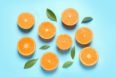 Photo of Flat lay composition with ripe oranges on color background