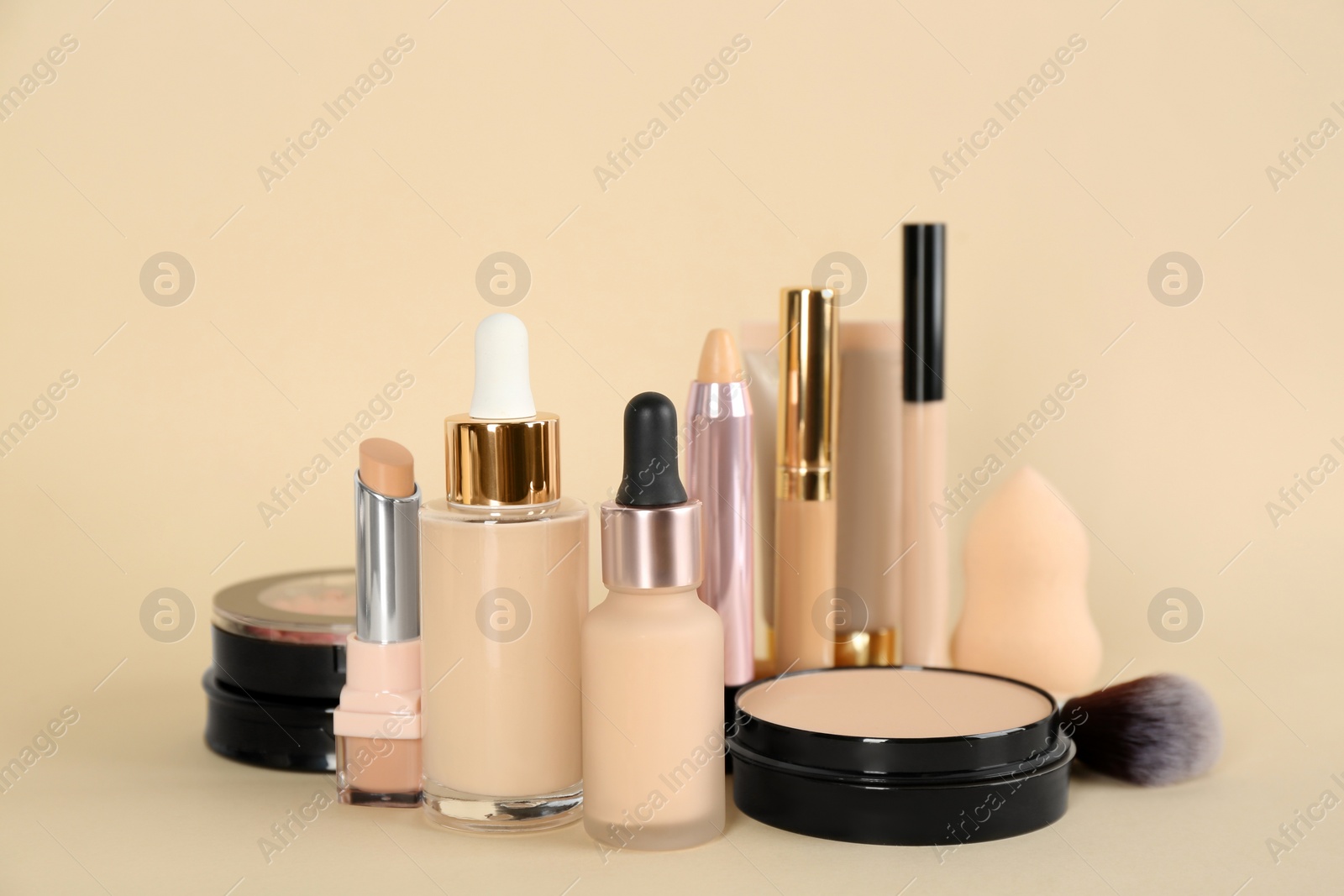 Photo of Foundation makeup products on beige background. Decorative cosmetics