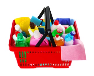 Shopping basket with different detergents and rag on white background