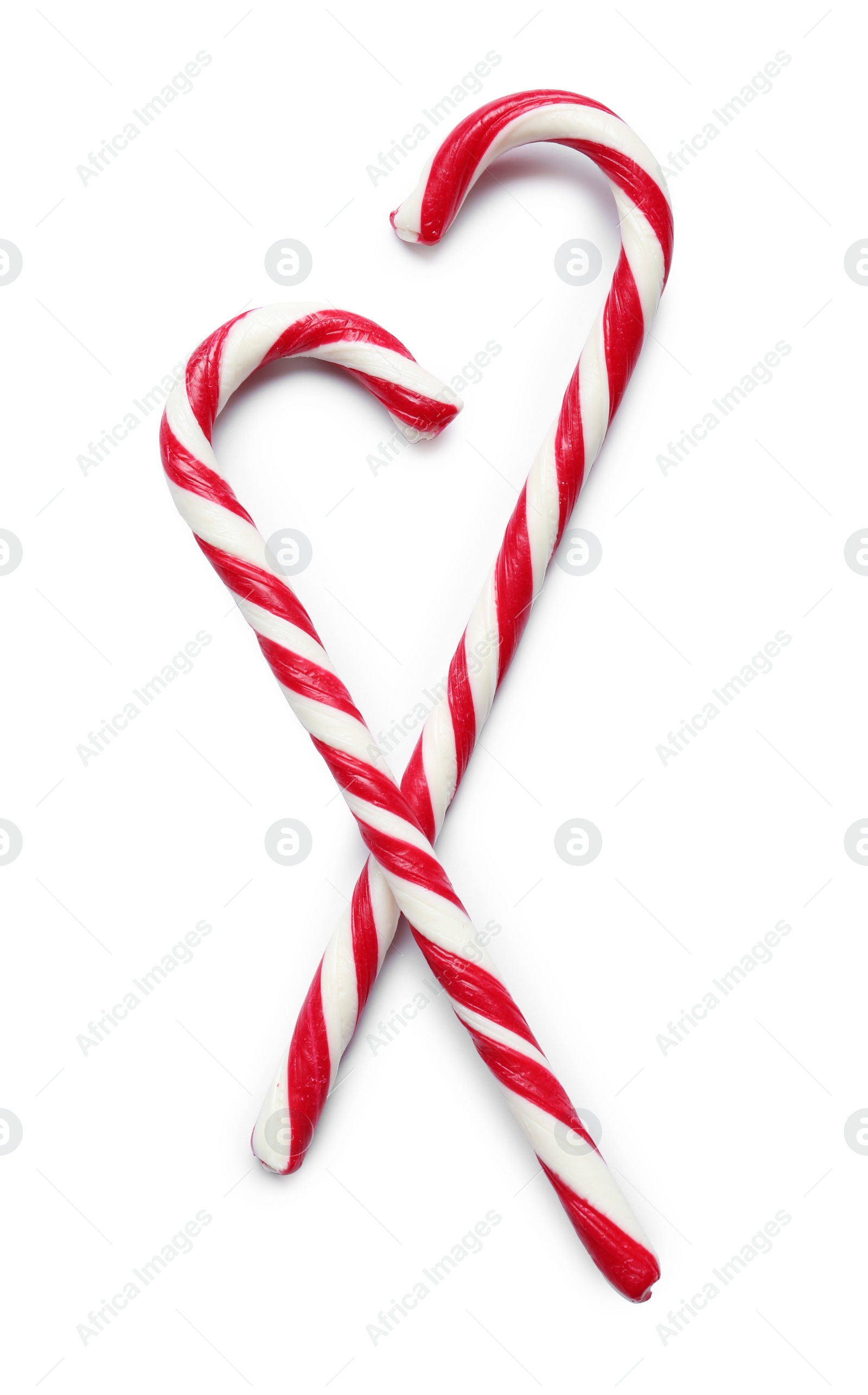 Image of Sweet candy canes on white background, top view. Christmas treat 