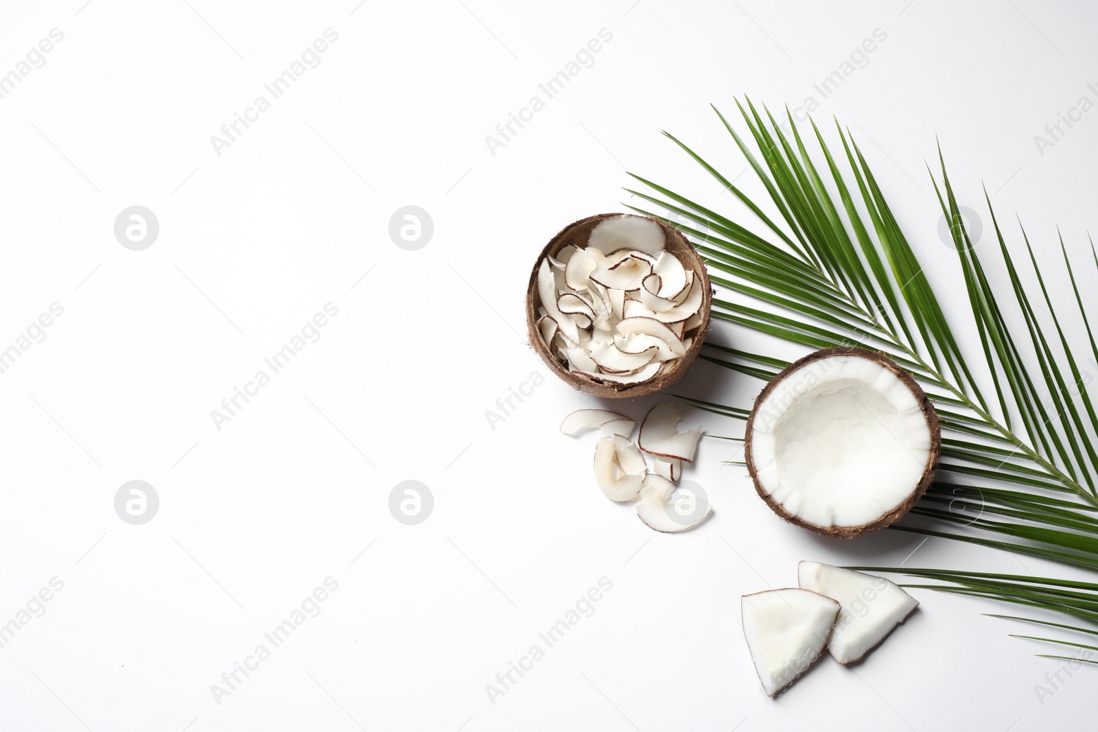 Photo of Composition with tasty coconut chips on white background, top view