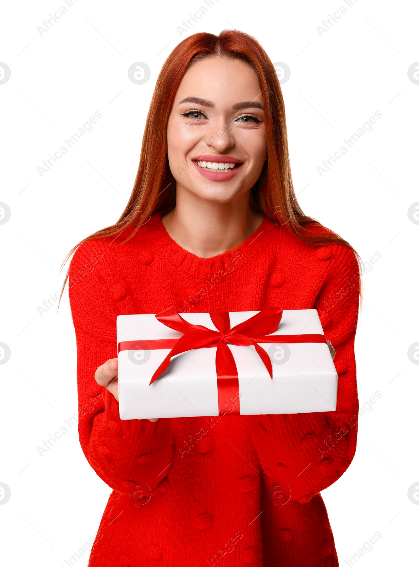 Photo of Young woman in red sweater with gift box on white background. Christmas celebration