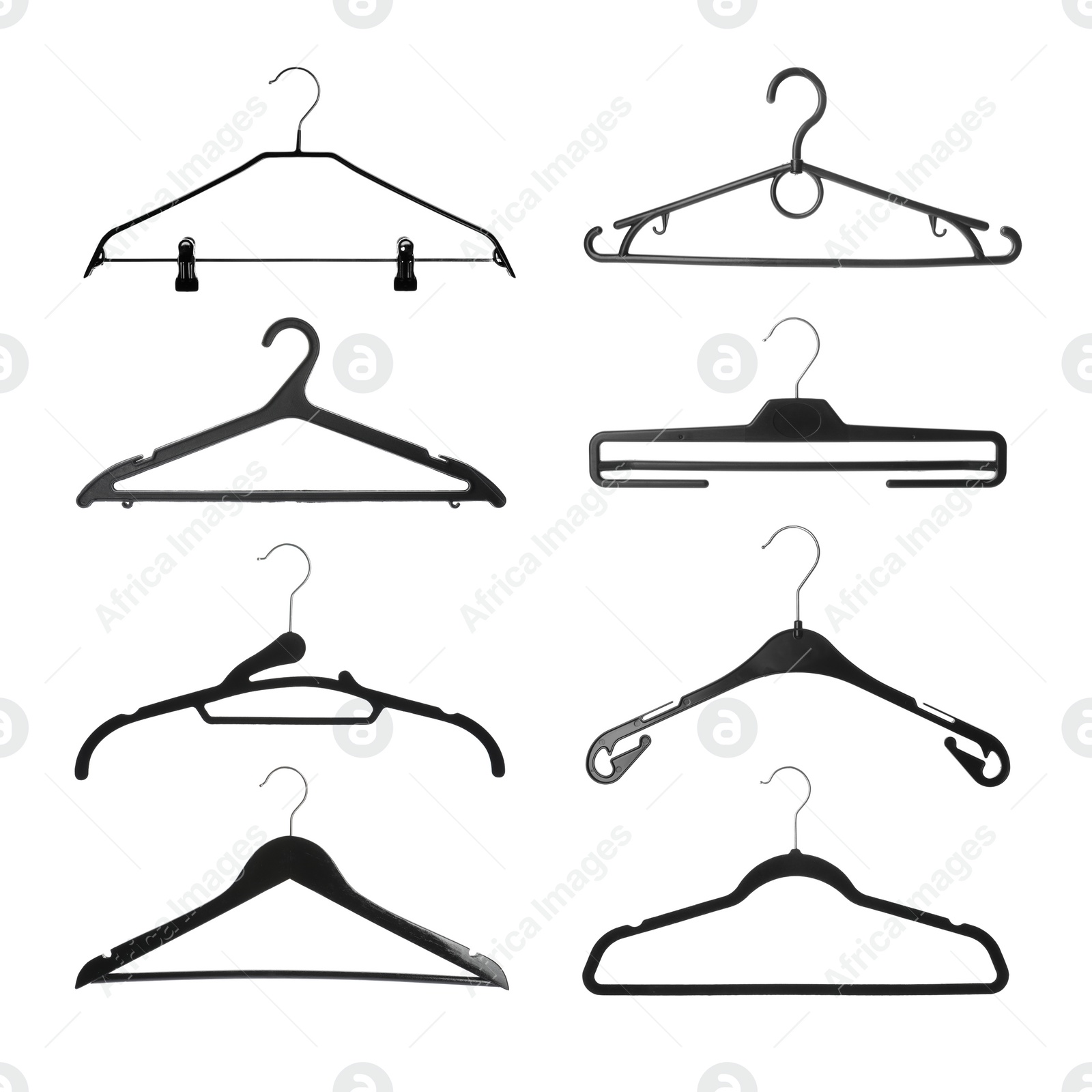 Image of Set with different empty hangers on white background