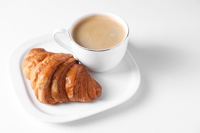 Photo of Breakfast time. Fresh croissant and coffee on white background. Space for text