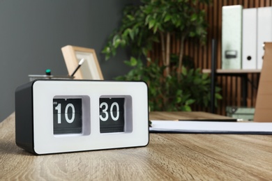 Stylish flip clock on table in office,  space for text. Time management