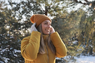 Photo of Young woman enjoying winter day in forest