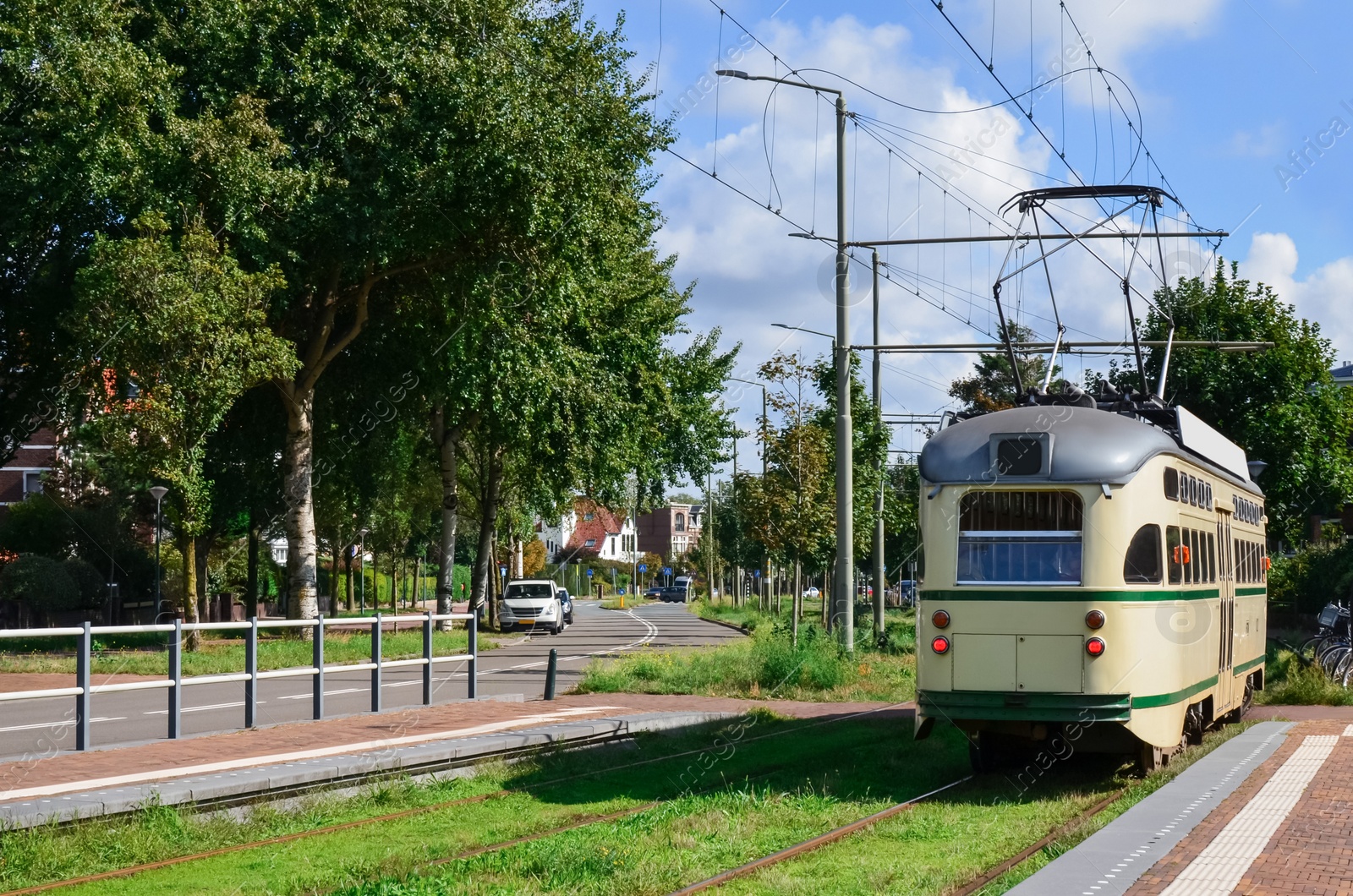 Photo of View of city street and modern tram