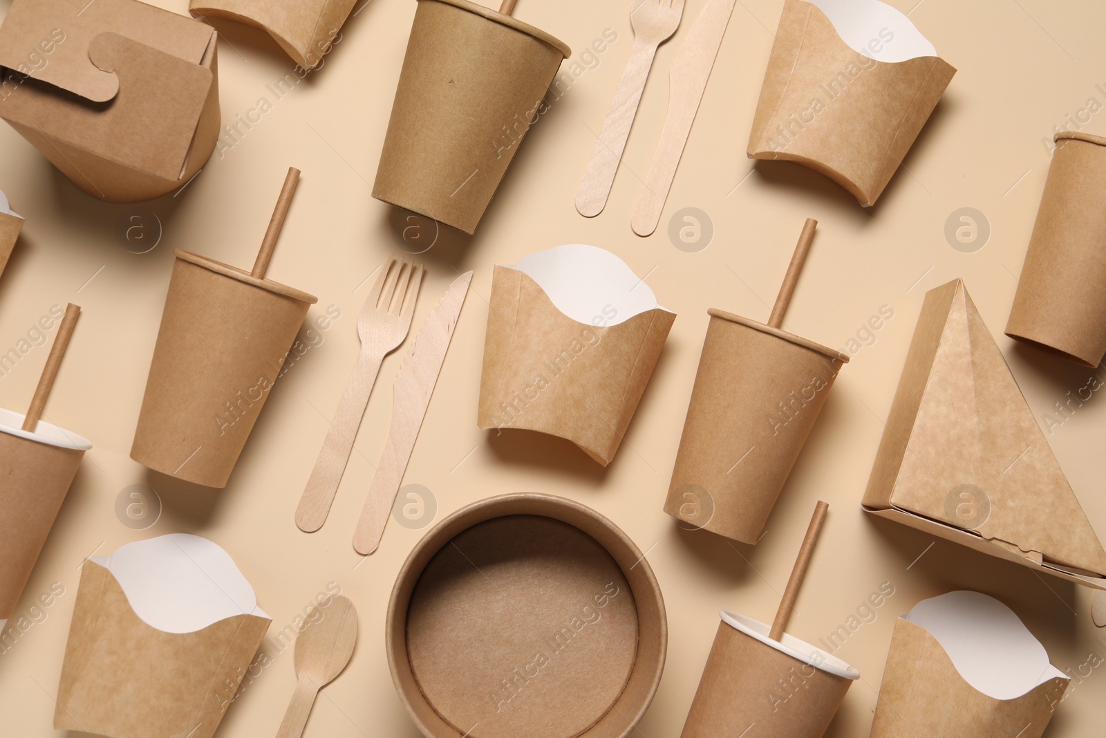 Photo of Flat lay composition with eco friendly food packagings on beige background