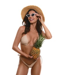 Photo of Beautiful woman in stylish bikini with pineapple on white background