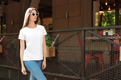 Young woman wearing white t-shirt on street