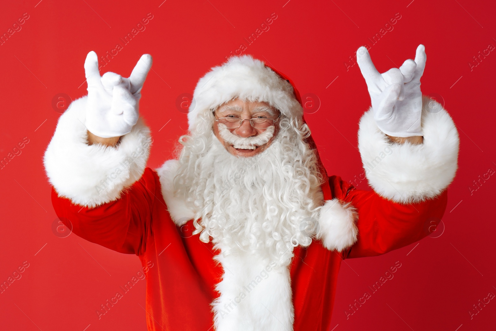 Photo of Portrait of authentic Santa Claus on color background