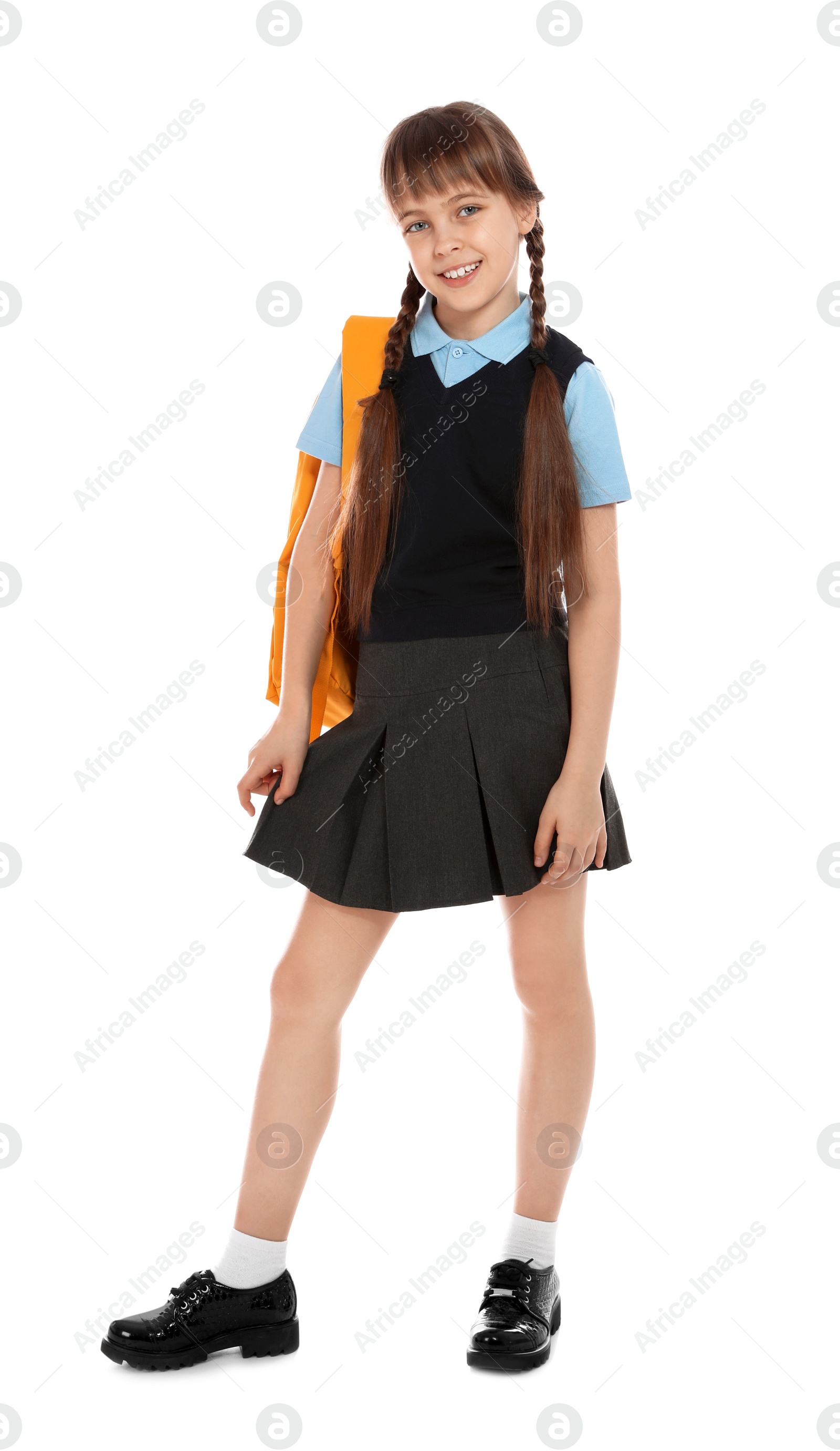 Photo of Full length portrait of cute girl in school uniform with backpack on white background