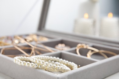 Photo of Elegant jewelry box with beautiful bijouterie, closeup
