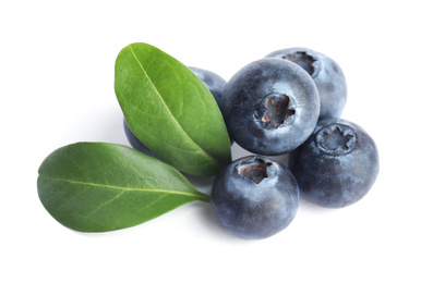 Fresh ripe blueberries with leaves on white background