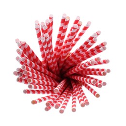 Photo of Striped paper cocktail tubes on white background, top view