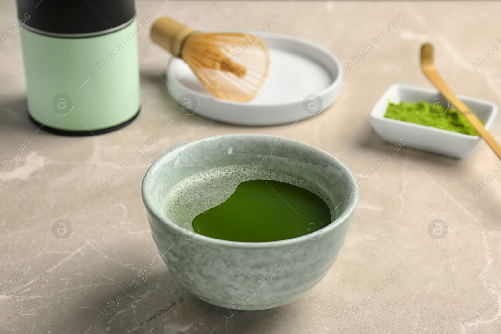 Photo of Chawan with fresh matcha tea on table