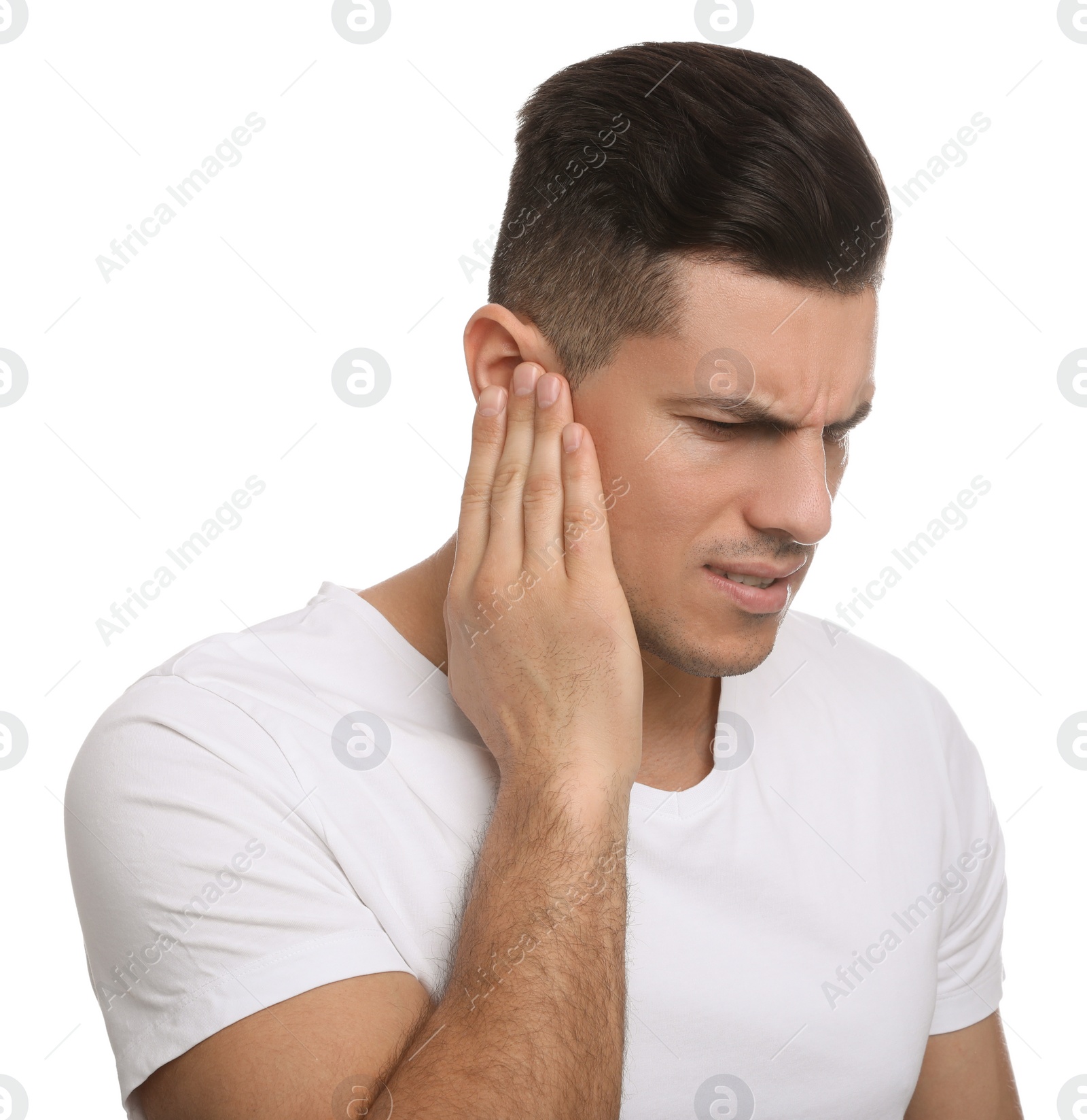 Photo of Man suffering from ear pain on white background