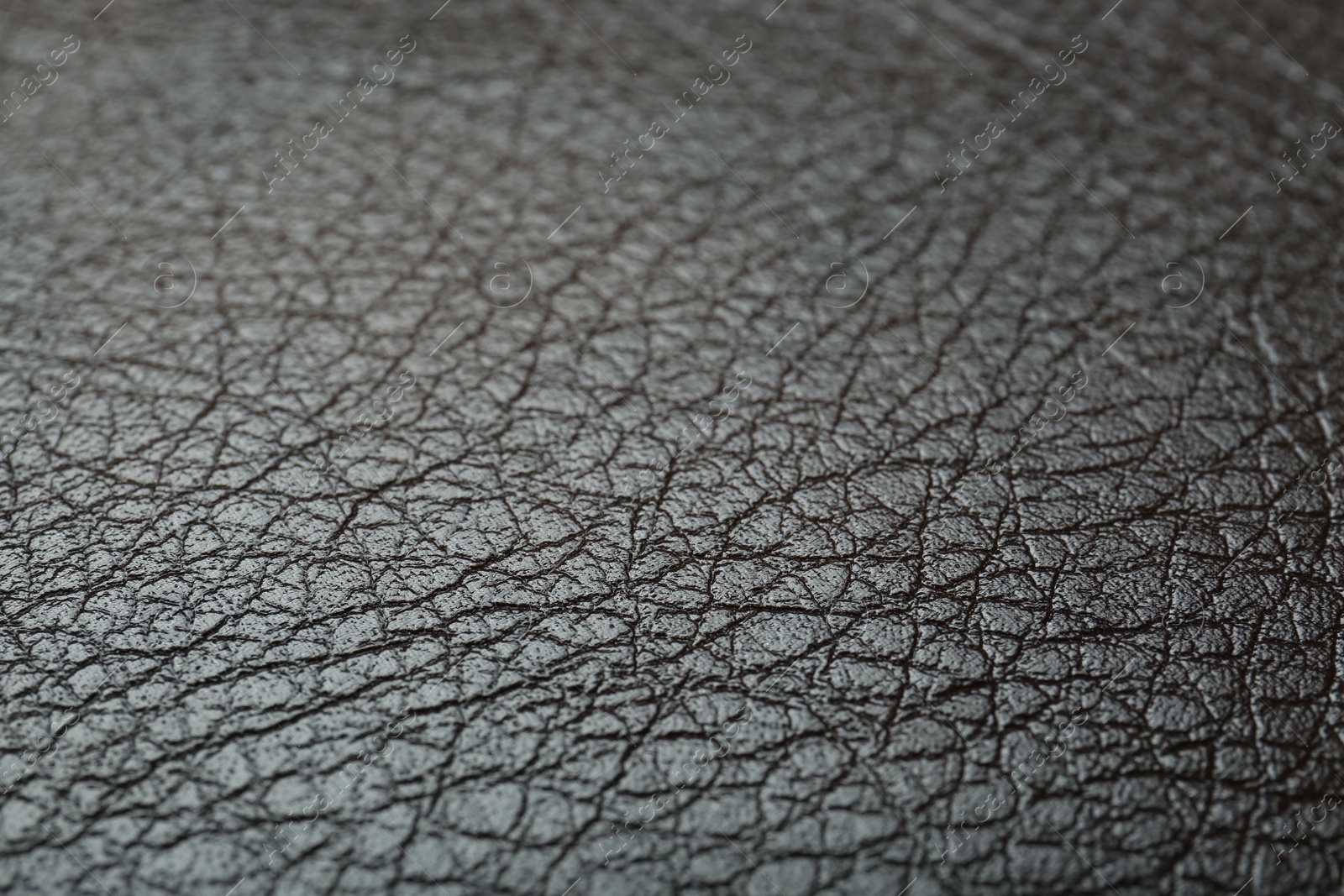 Photo of Texture of brown leather as background, closeup