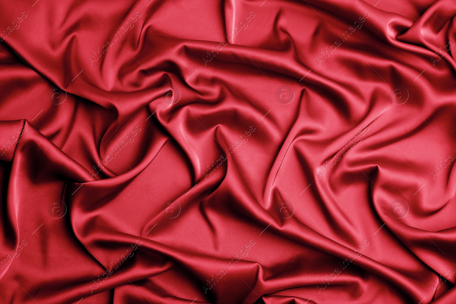 Image of Delicate red silk fabric as background, top view