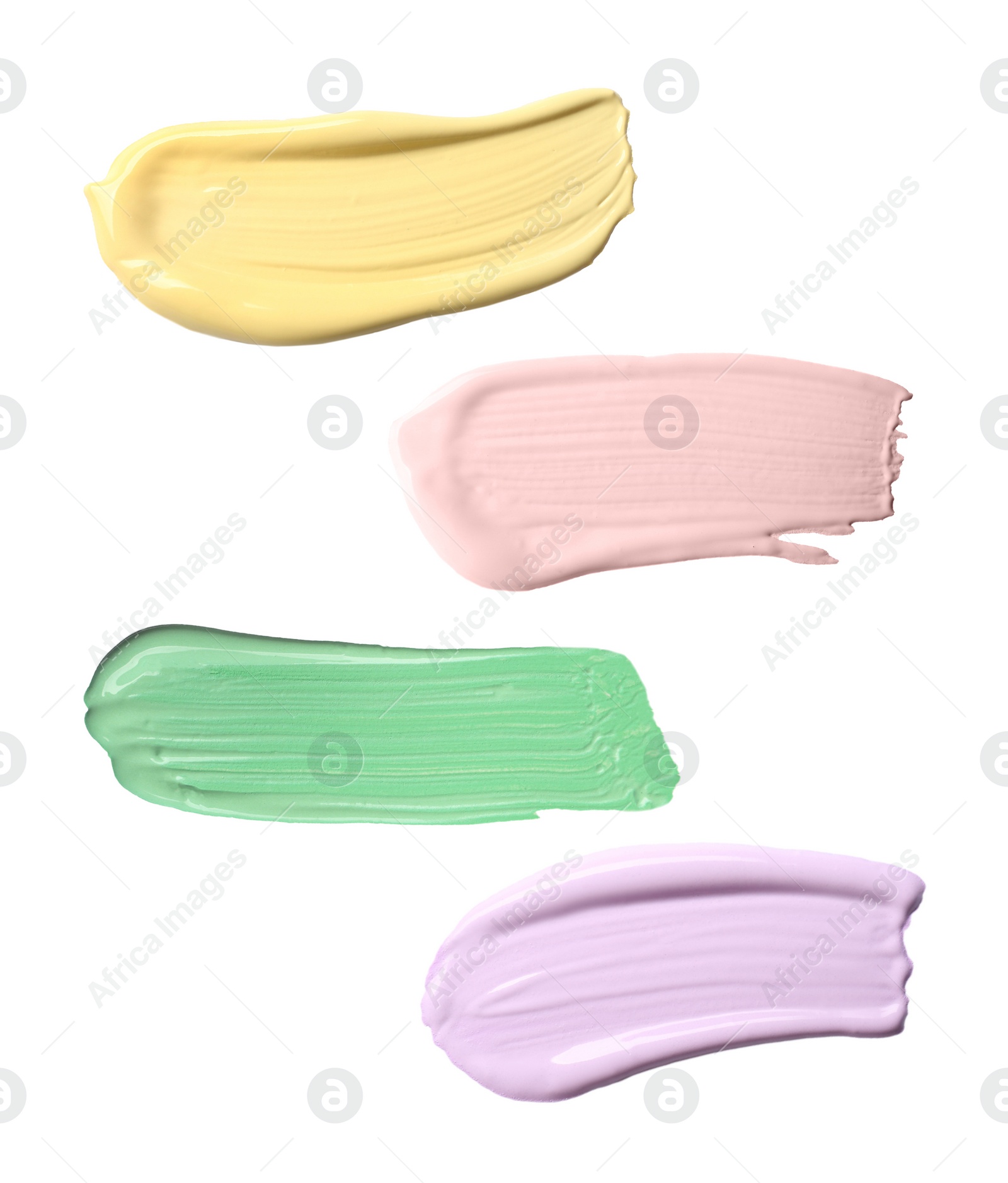Image of Set with strokes of color correcting concealers on white background, top view