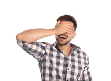 Young man being blinded on white background