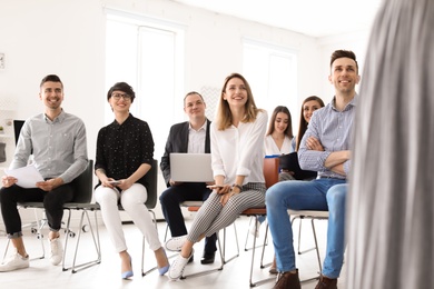 Photo of Young people having business training in office