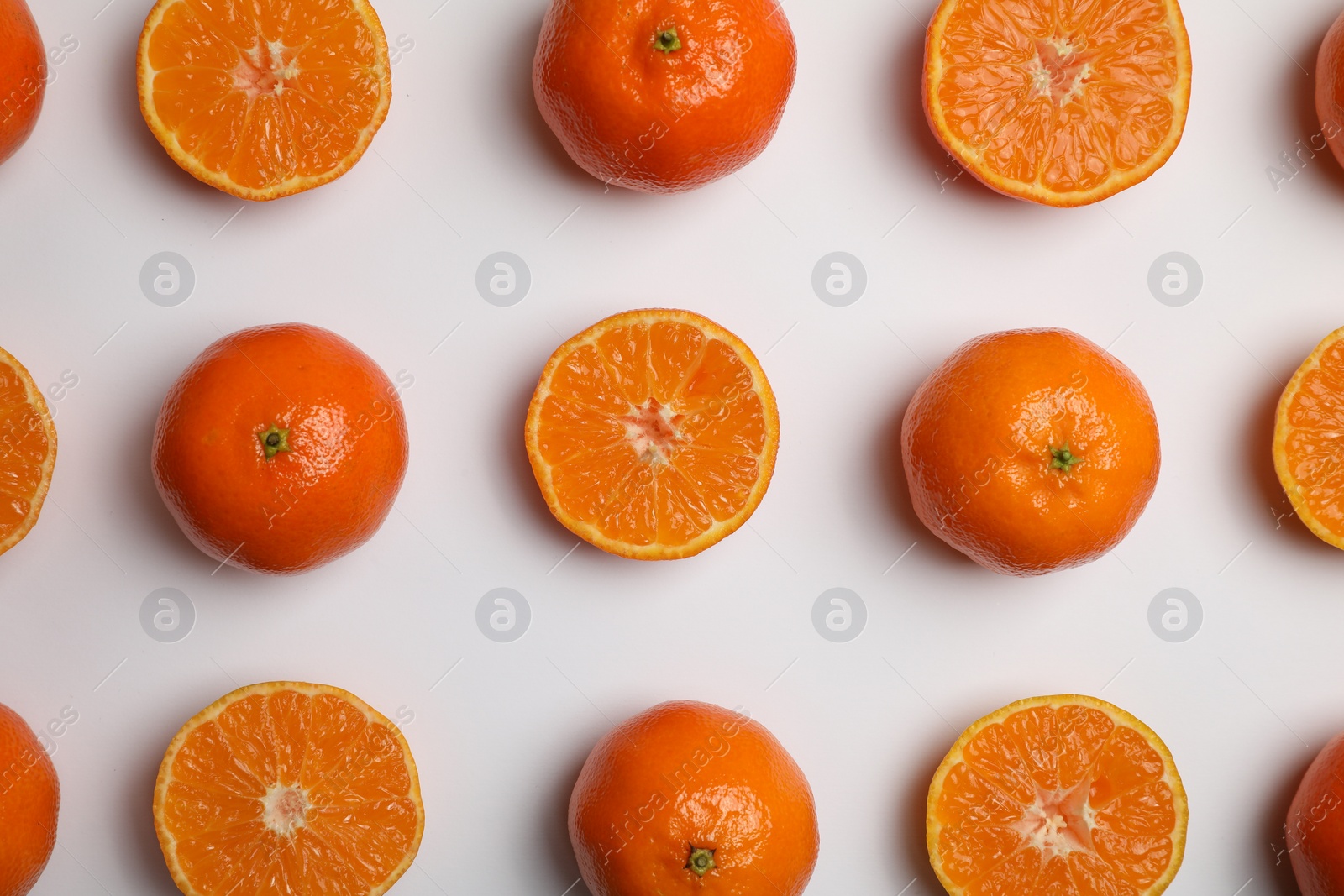 Photo of Delicious tangerines on white background, flat lay