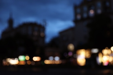 Blurred view of modern city at evening. Bokeh effect