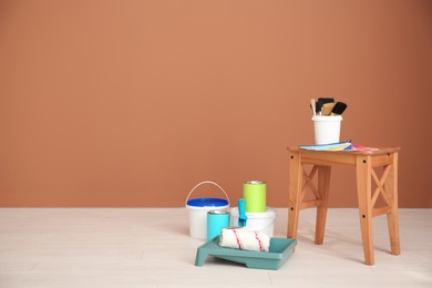 Photo of Decorator's tools near color wall