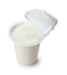 Plastic cup with creamy yogurt on white background