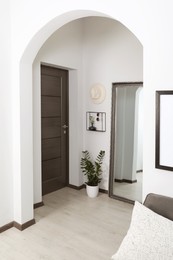 Modern hallway interior with large mirror near door