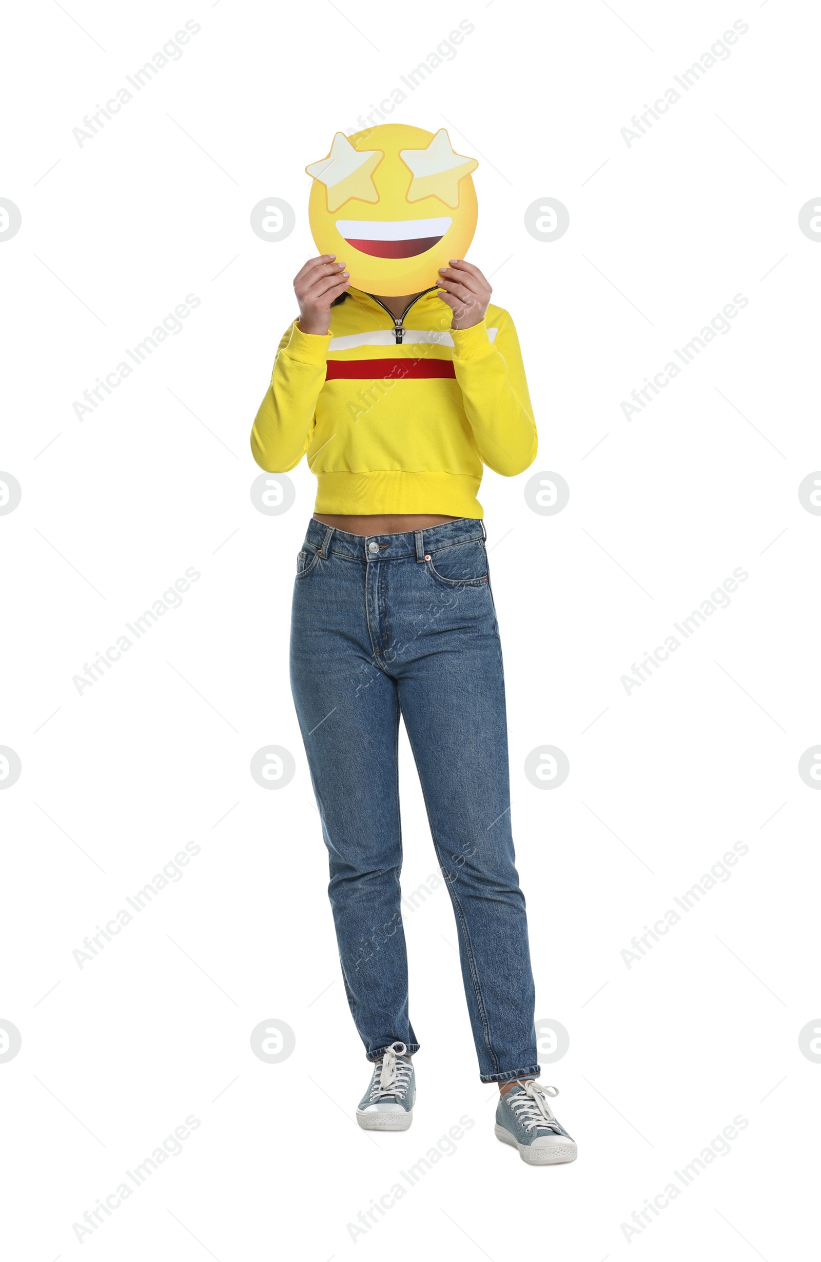 Photo of Woman holding emoticon with stars instead of eyes on white background