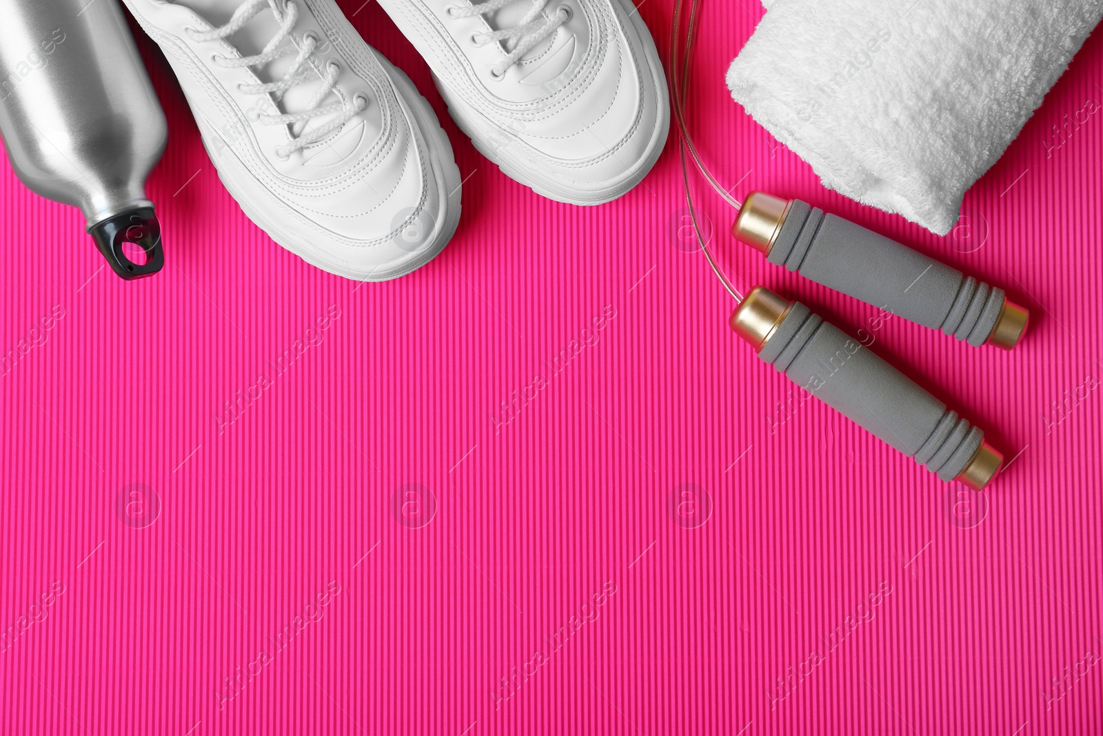 Photo of Flat lay composition with fitness equipment and space for text on color background