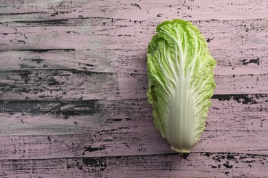Photo of Fresh ripe Chinese cabbage on rustic table, top view. Space for text