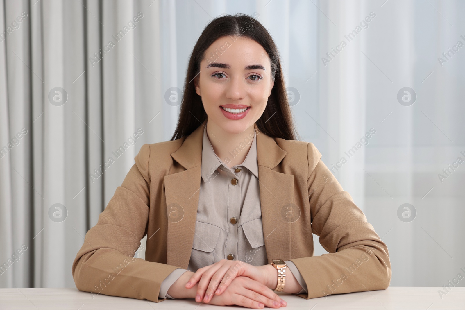 Photo of Beautiful young woman having online video call at home, view from camera